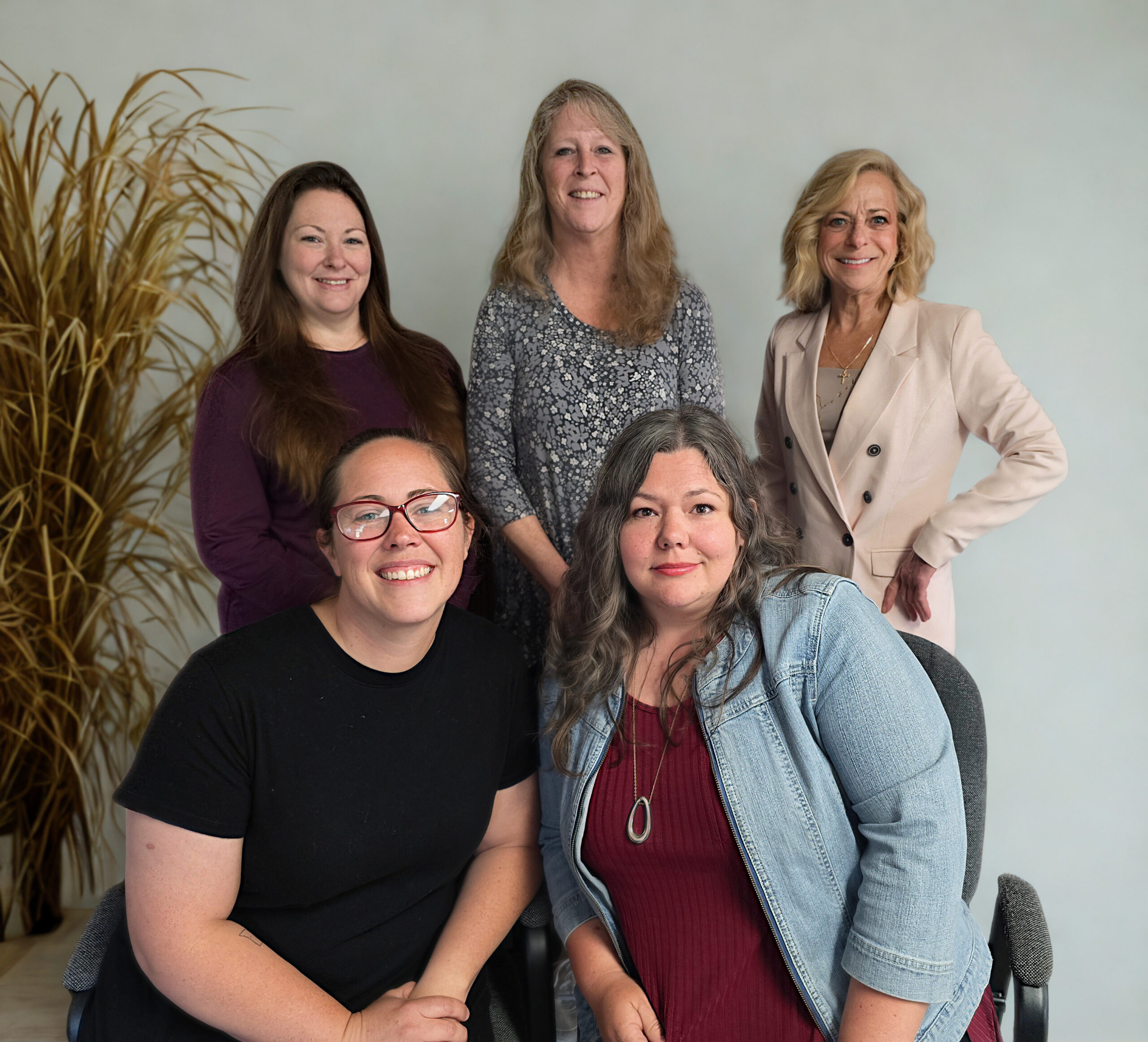 Five members of LCBSS Staff smiling for a professional photo